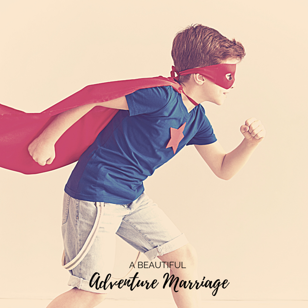 A Little Boy dress in a cape and mask in a running hero pose.