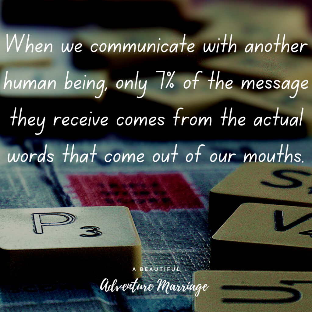 A bunch of scramble pieces thrown on a table with the words "When we communicate with another human being, only 7% of the message they receive comes from the actual words that come out of our mouths." written over the picture.