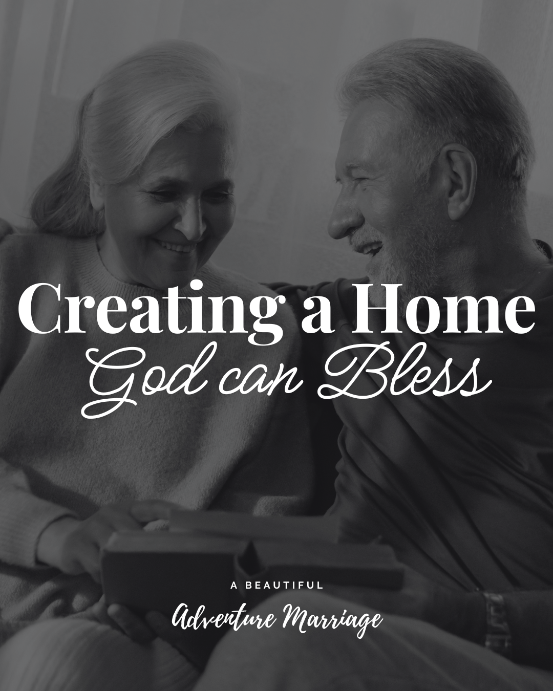 A older couple sitting together on the couch reading a Bible